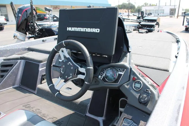 Slide: The Image of 2022 Skeeter FXR21 Apex boat dashboard with Humminbird electronics and steering wheel. - 4