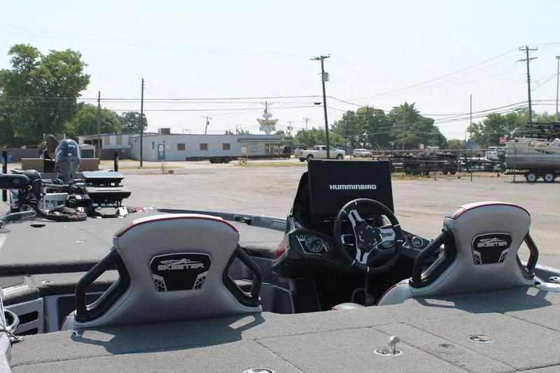Slide: The Image of 2022 Skeeter FXR21 Apex boat interior with steering wheel and Humminbird electronics. - 9