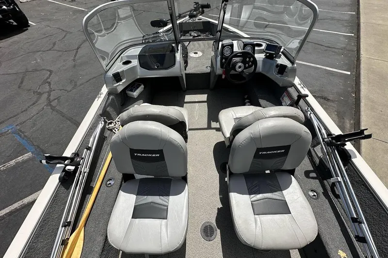 Slide: The Image of 2019 Tracker Pro Guide V-16 WT boat interior with dual seats and steering console. - 10