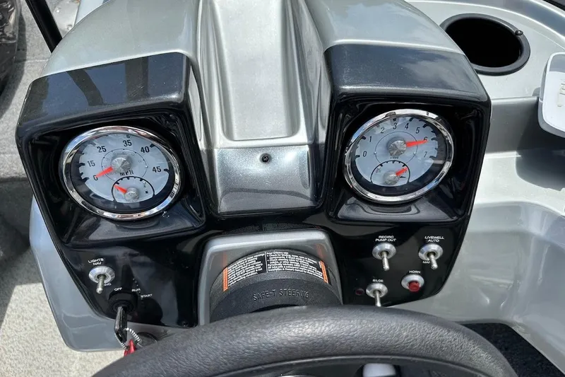 Slide: The Image of 2019 Tracker Pro Guide V-16 WT dashboard with gauges and controls. - 22
