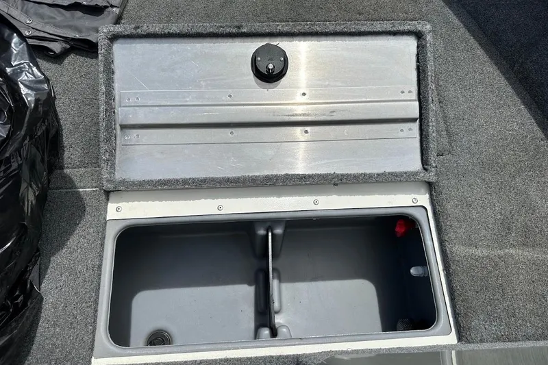 Slide: The Image of 2019 Tracker Pro Guide V-16 WT boat storage compartment with open lid. - 28