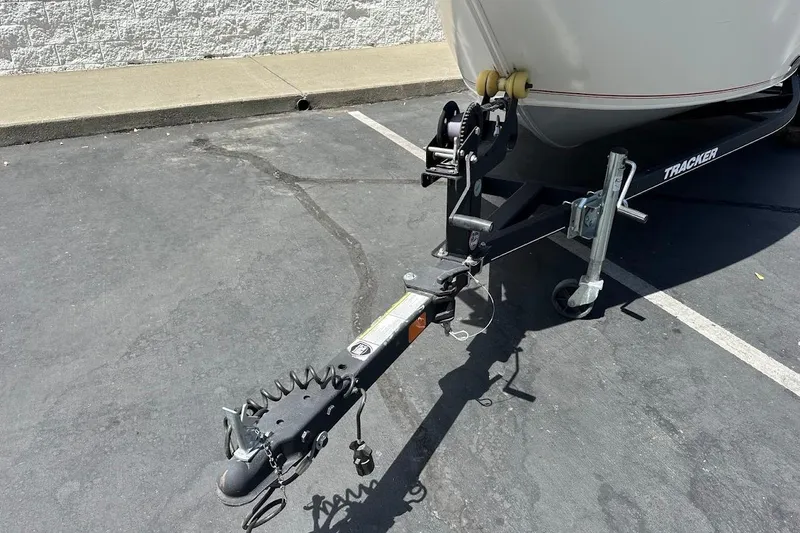Slide: The Image of 2019 Tracker Pro Guide V-16 WT boat trailer hitch in parking lot. - 5