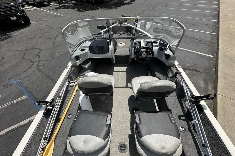 Slide: The Image of 2019 Tracker Pro Guide V-16 WT boat interior with seating and steering console. - 9