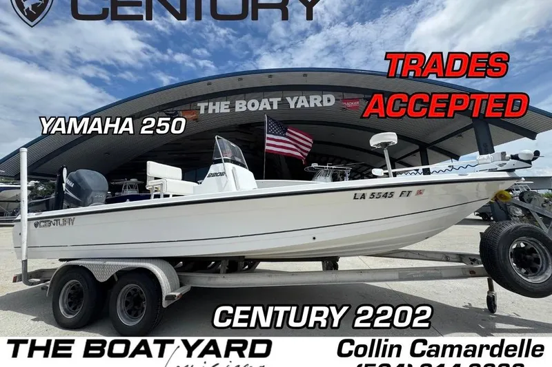 Slide: The Image of 2008 Century 2202 BAY boat on trailer under clear sky. - 1