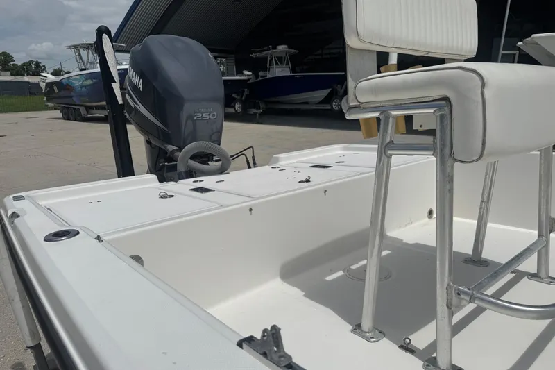 Slide: The Image of 2008 Century 2202 BAY boat on trailer at The Boat Yard, American flag displayed. - 15