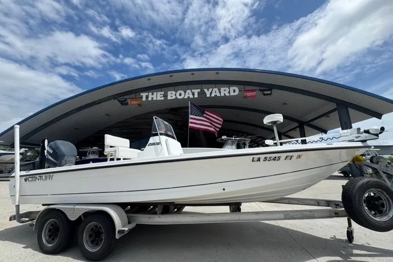 Slide: The Image of 2008 Century 2202 BAY boat on trailer in outdoor storage area. - 2