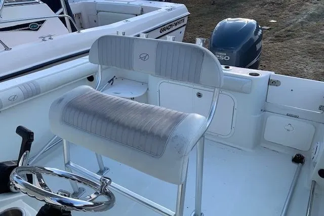 Slide: The Image of 2009 Sailfish 2360 CC boat interior with seating and Yamaha 250 engine. - 4