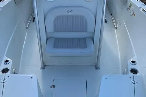 Slide: The Image of 2009 Sailfish 2360 CC boat interior with seating and storage compartments. - 5