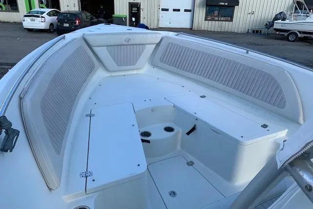 Slide: The Image of 2009 Sailfish 2360 CC boat interior with seating and storage compartments. - 6