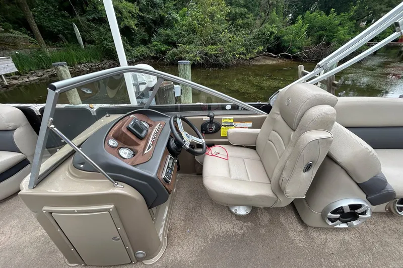 Slide: The Image of 2010 Premier 250 S-Series boat interior with steering console and captain's chair. - 10