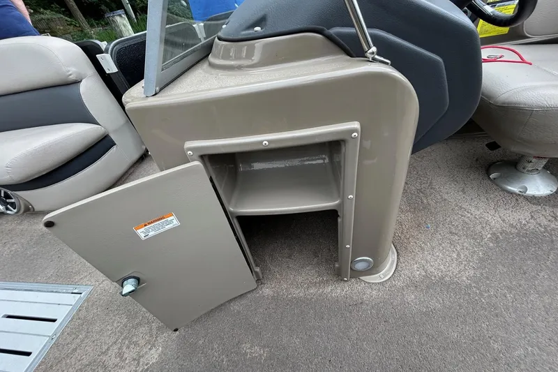 Slide: The Image of Open storage compartment on a 2010 Premier 250 S-Series boat interior. - 17