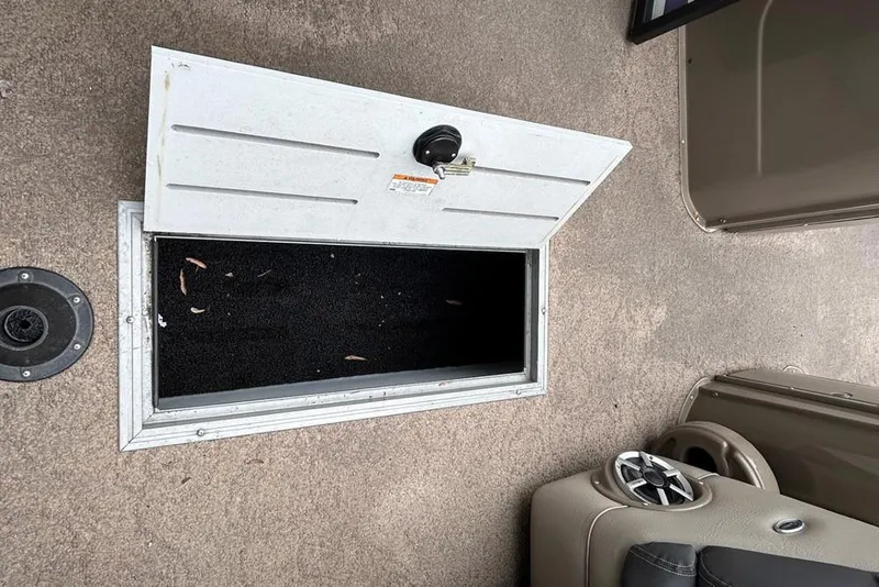 Slide: The Image of Open storage compartment on 2010 Premier 250 S-Series boat deck. - 20