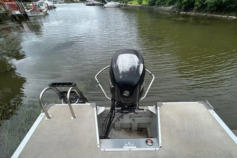 Slide: The Image of Pontoon boat with Mercury outboard motor on a calm river, Premier 250 S-Series, 2010 model. - 8
