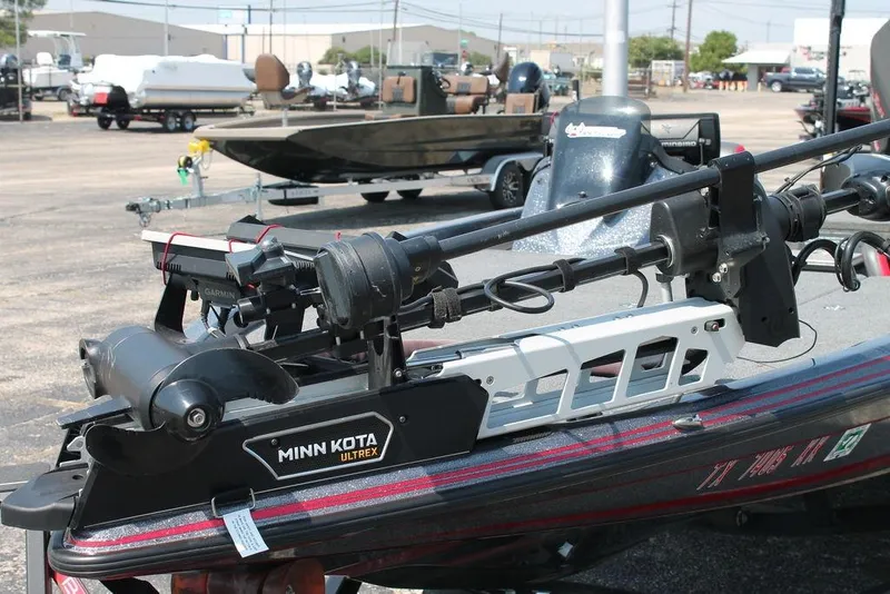 Slide: The Image of 2022 Phoenix 721 Pro XP boat with Minn Kota Ultrex trolling motor in a dealership lot. - 5