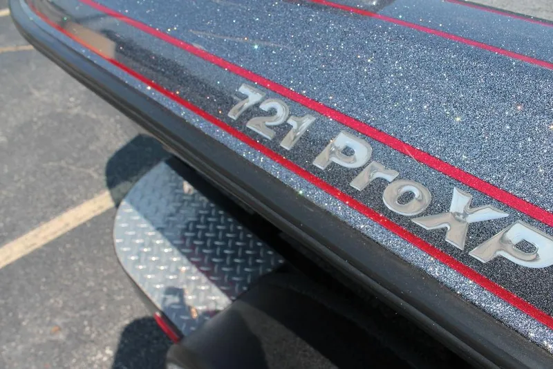 Slide: The Image of 2022 Phoenix 721 Pro XP boat with glittery finish and red accents. - 8