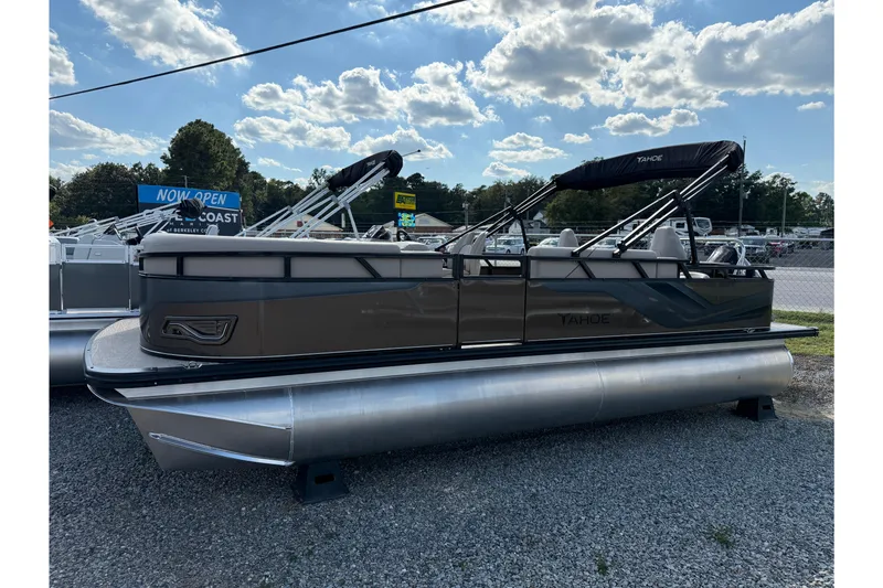 The Image of 2025 Tahoe Pontoon Sport 85 Rear Fish boat displayed outdoors under a cloudy sky. - 0