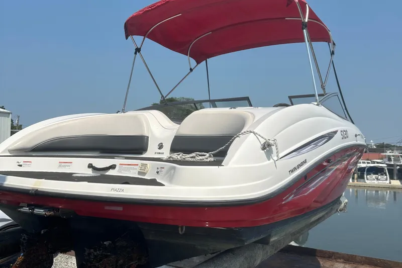 Slide: The Image of 2007 Yamaha Boats SX210 with red canopy, docked at marina. - 1