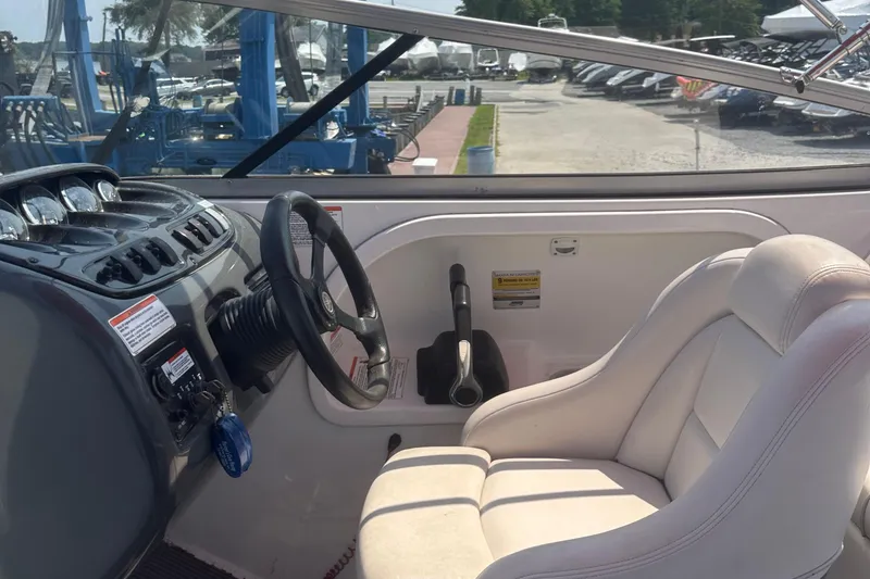 Slide: The Image of 2007 Yamaha Boats SX210 interior with steering wheel and control panel. - 14