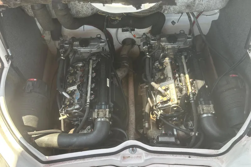 Slide: The Image of Engine compartment of a 2007 Yamaha Boats SX210, showcasing dual engines and components. - 16