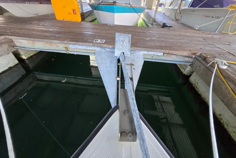 Slide: The Image of Bow of 2013 Atlas Boat Works Pompano 21 docked at marina. - 10