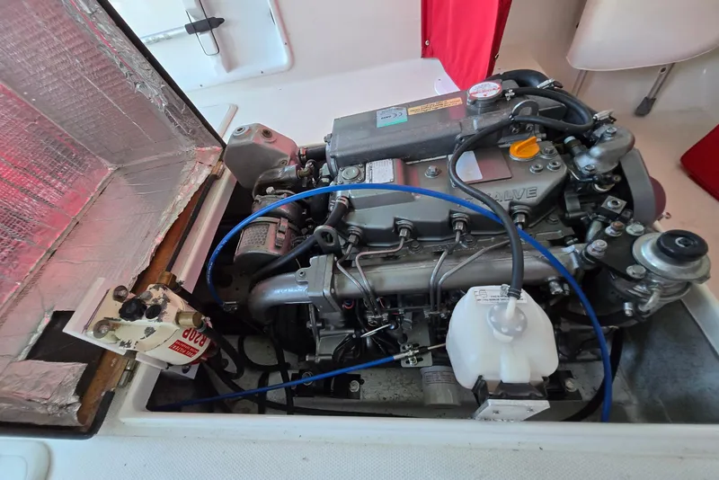 Slide: The Image of Engine compartment of a 2013 Atlas Boat Works Pompano 21, showcasing detailed mechanical components. - 24