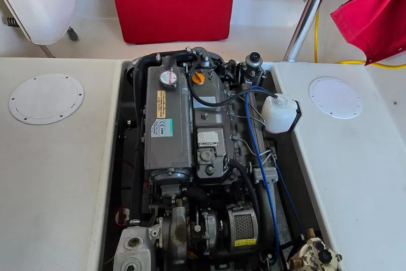 Slide: The Image of Engine compartment of a 2013 Atlas Boat Works Pompano 21, showcasing mechanical components. - 25