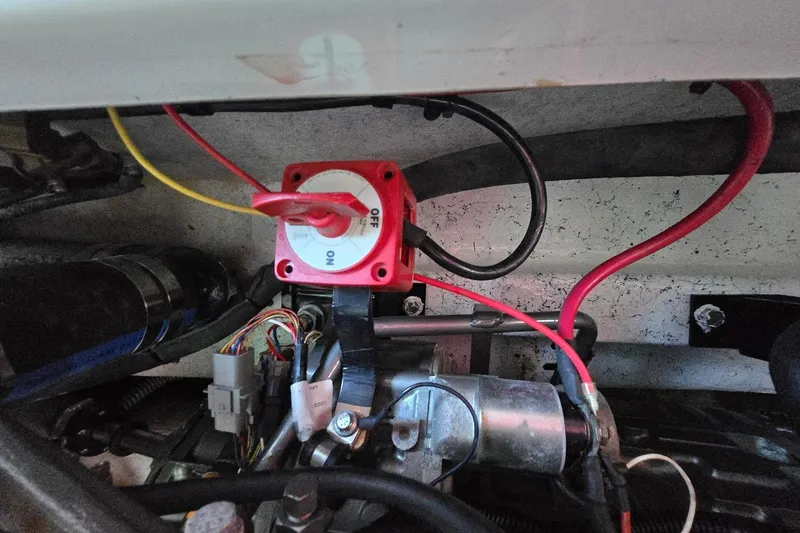 Slide: The Image of Engine compartment of 2013 Atlas Boat Works Pompano 21 with wiring and switch. - 28