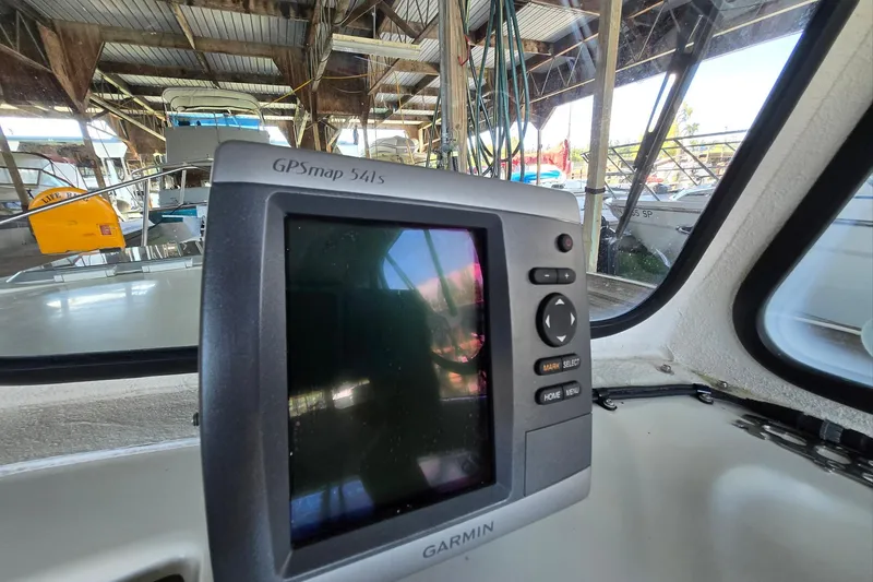 Slide: The Image of Garmin GPSmap 541s on 2013 Atlas Boat Works Pompano 21 in marina setting. - 37