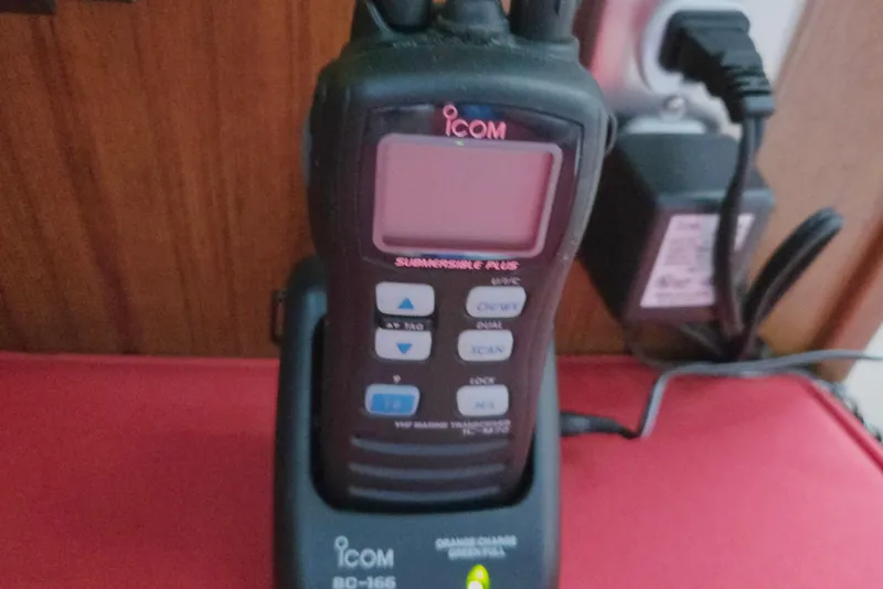 Slide: The Image of Icom marine radio on a 2013 Atlas Boat Works Pompano 21, charging in its dock. - 38