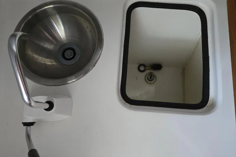 Slide: The Image of Stainless steel sink and storage compartment on 2013 Atlas Boat Works Pompano 21. - 48