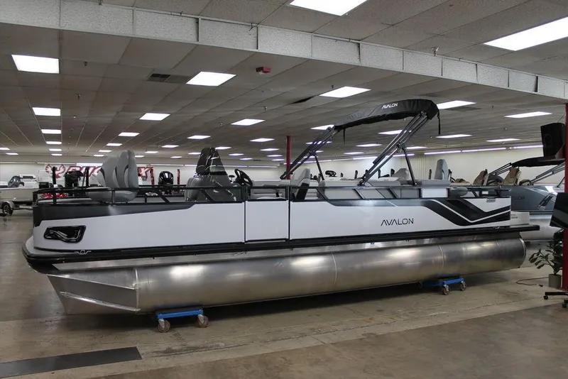 The Image of 2025 Avalon Venture 85 Center Console Fish 25 FT boat displayed indoors. - 1
