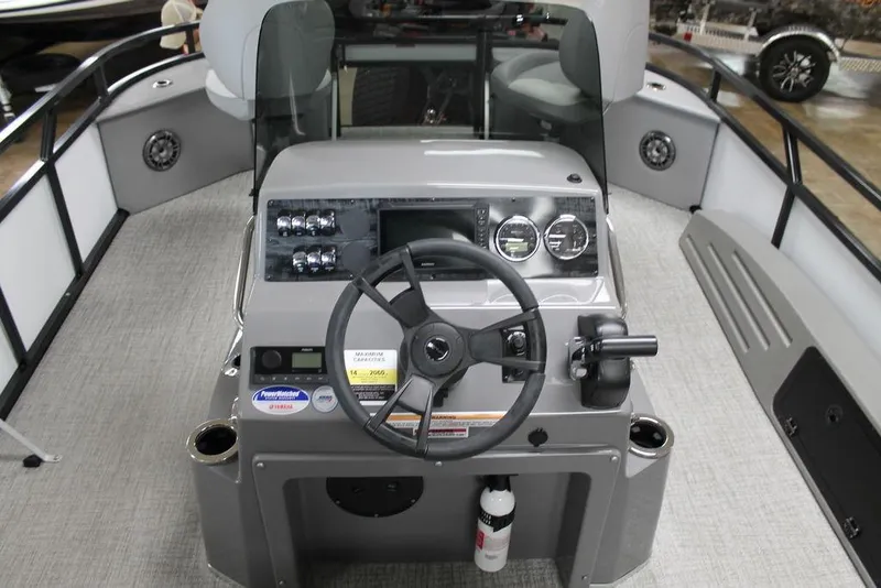 Slide: The Image of 2025 Avalon Venture 85 Center Console Fish boat interior with steering wheel and control panel. - 10