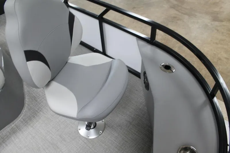 Slide: The Image of 2025 Avalon Venture 85 Center Console Fish boat interior with gray seating and railing. - 12