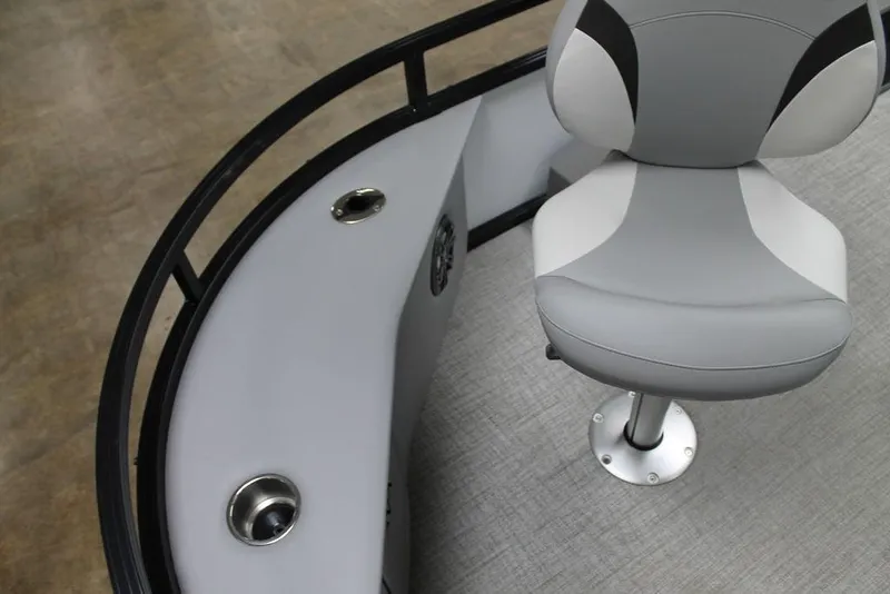 Slide: The Image of 2025 Avalon Venture 85 Center Console Fish boat interior with gray seating and cup holders. - 9