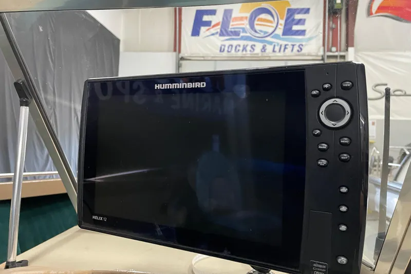 Slide: The Image of Humminbird Helix 12 fish finder on a 1997 Lund 1700 Pro Sport boat. - 11