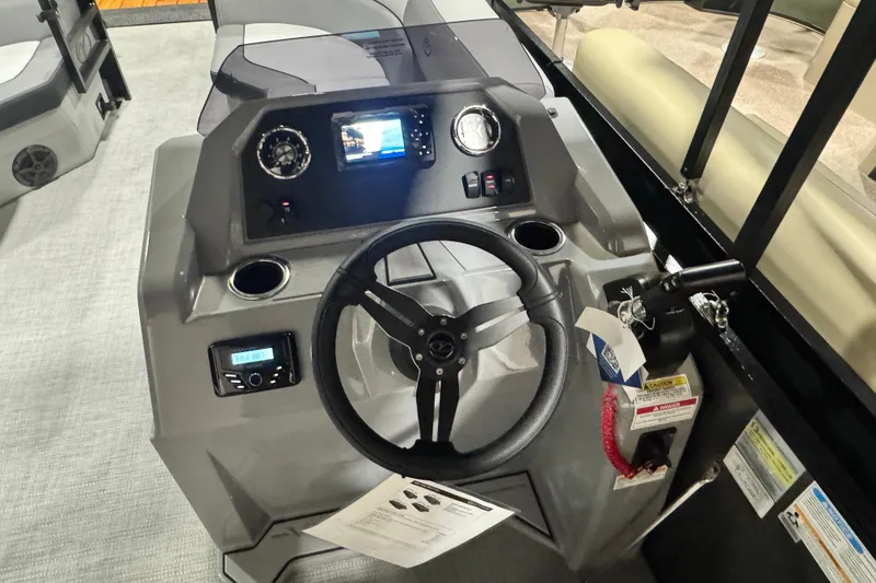 Slide: The Image of 2026 Veranda Vista 22F2+2 boat dashboard with steering wheel and control panel. - 6