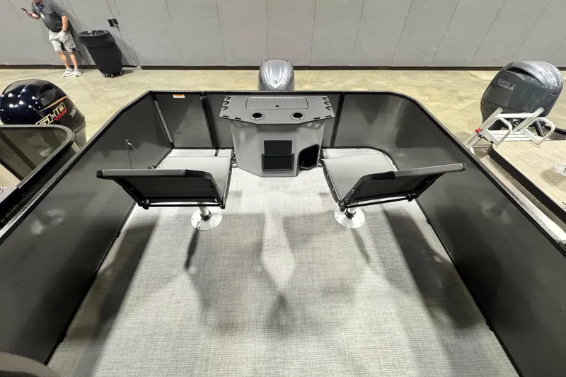 Slide: The Image of 2026 Veranda Vista 22F2+2 boat interior with seating and motor display. - 8