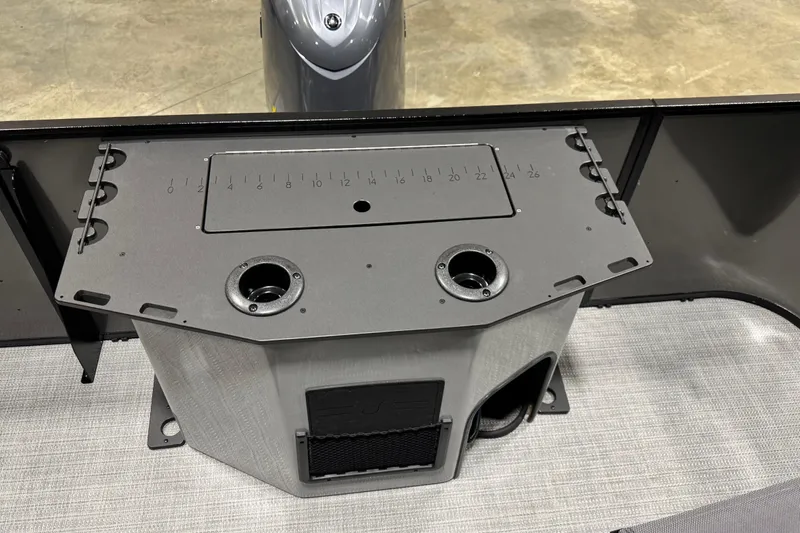 Slide: The Image of 2026 Veranda Vista 22F2+2 boat console with integrated cup holders and measurement markings. - 9