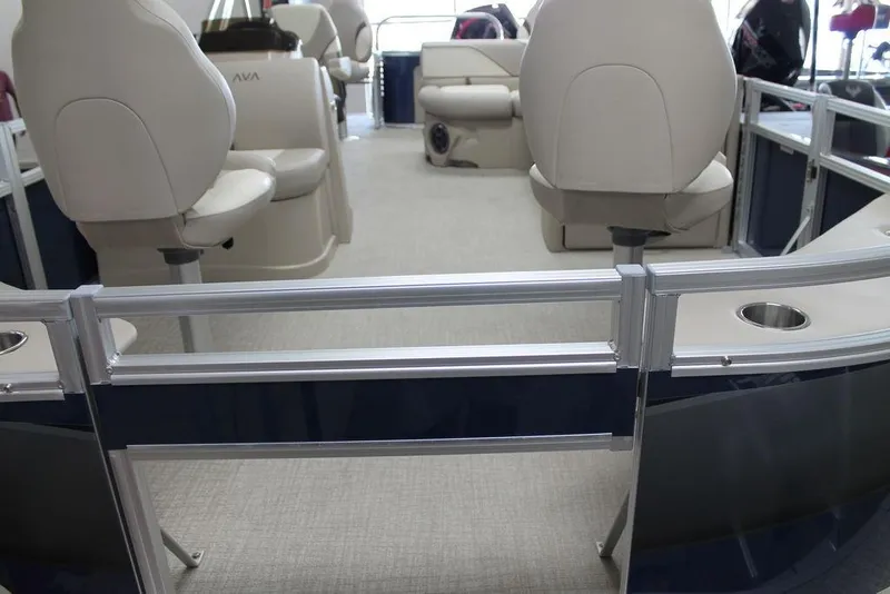 Slide: The Image of 2025 Avalon Venture 85 Quad Fish 21 FT interior with beige seating and metal railings. - 6
