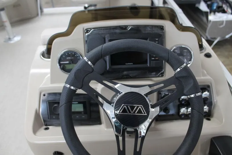 Slide: The Image of Steering console of 2025 Avalon Venture 85 Quad Fish 21 FT boat with modern controls. - 7