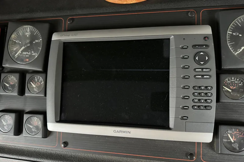 Slide: The Image of Garmin GPS display and gauges on 1989 Bayliner 4588 Pilothouse Motor Yacht dashboard. - 22