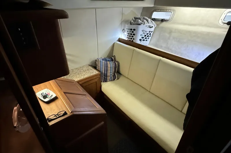 Slide: The Image of Cozy interior of 1989 Bayliner 4588 Pilothouse Motor Yacht with sofa and storage. - 45