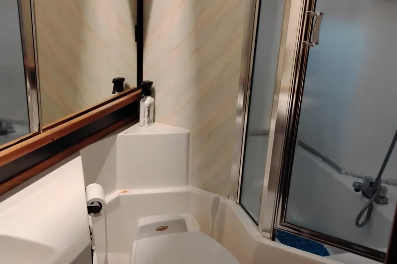 Slide: The Image of Bathroom interior of 1989 Bayliner 4588 Pilothouse yacht with shower and mirror. - 47