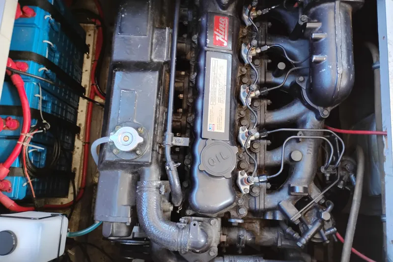 Slide: The Image of Engine compartment of a 1989 Bayliner 4588 Pilothouse, showcasing detailed mechanical components. - 51