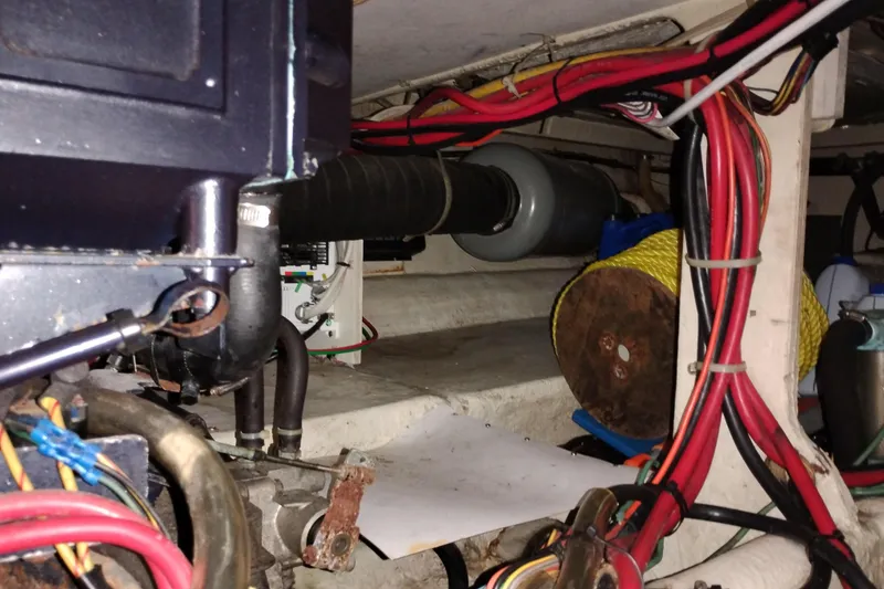 Slide: The Image of Engine room of 1989 Bayliner 4588 Pilothouse with wiring and components visible. - 53