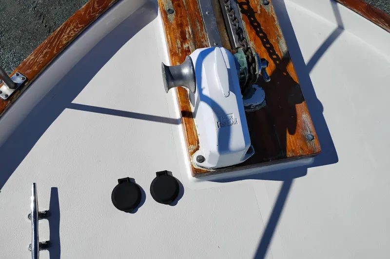 Slide: The Image of 1989 Bayliner 4588 Pilothouse boat deck with anchor winch and chain. - 56
