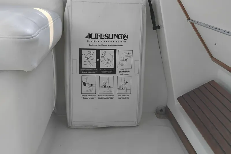 Slide: The Image of Lifesling2 rescue system on 1989 Bayliner 4588 Pilothouse boat, featuring safety instructions. - 9