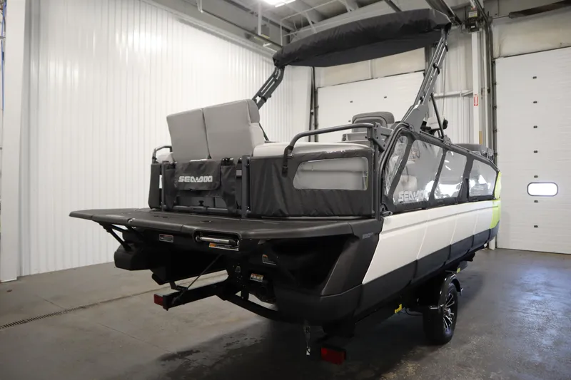 Slide: The Image of 2024 Sea-Doo Switch Sport/Cruise 21, rear view in a garage setting. - 11