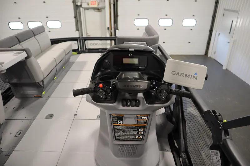 Slide: The Image of 2024 Sea-Doo Switch Sport/Cruise 21 dashboard with Garmin navigation system in a garage. - 24