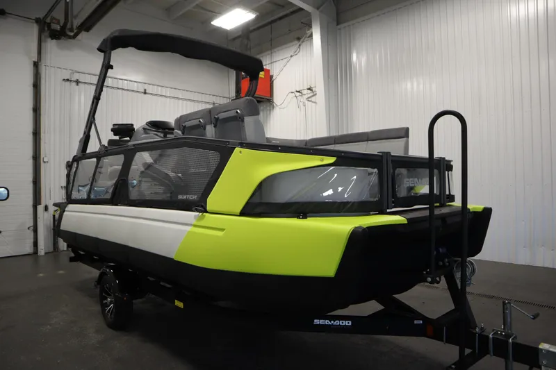 Slide: The Image of 2024 Sea-Doo Switch Sport/Cruise 21, 230 hp, in a showroom setting. - 9